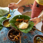 Rice and curry served in traditional rural kitchen.